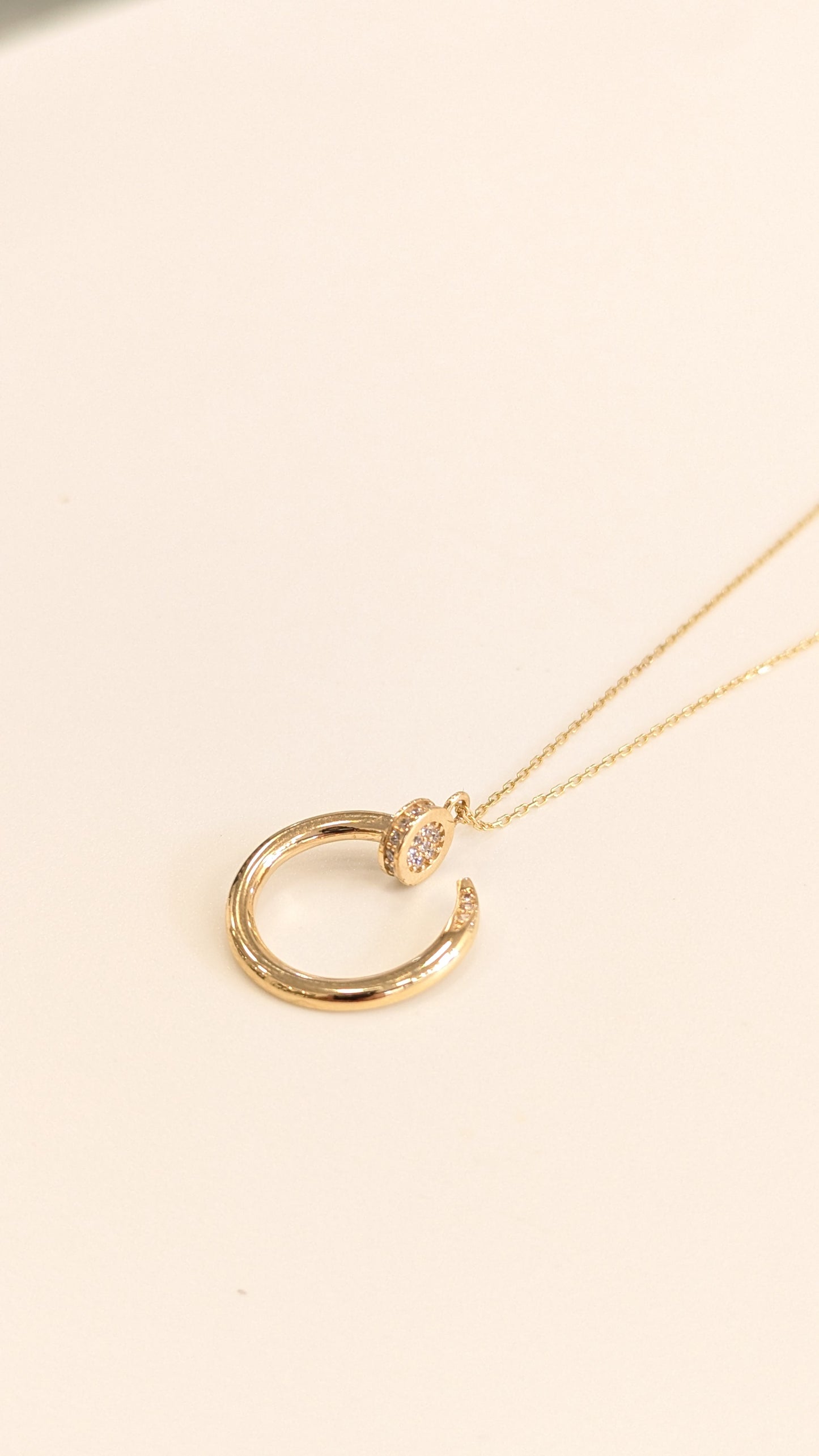 Gold Curved Nail Necklace