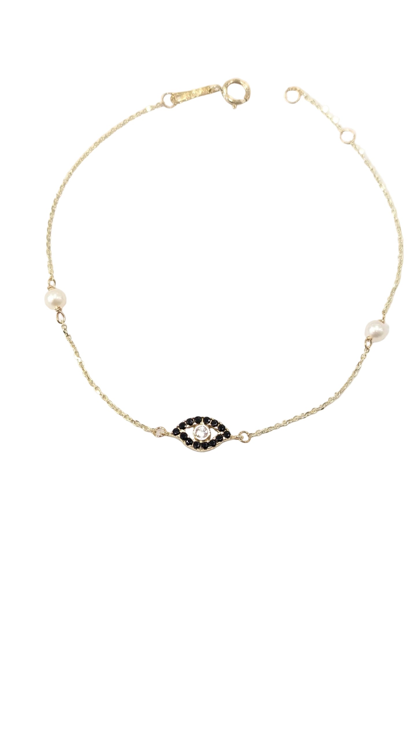 Gold necklace with a black and white gemstone on a white background
